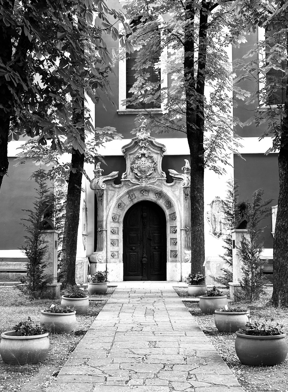 a black and white photo of an entrance to a building