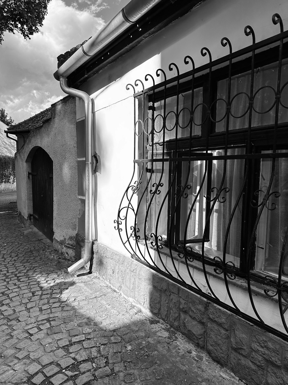 a black and white photo of a window on a building