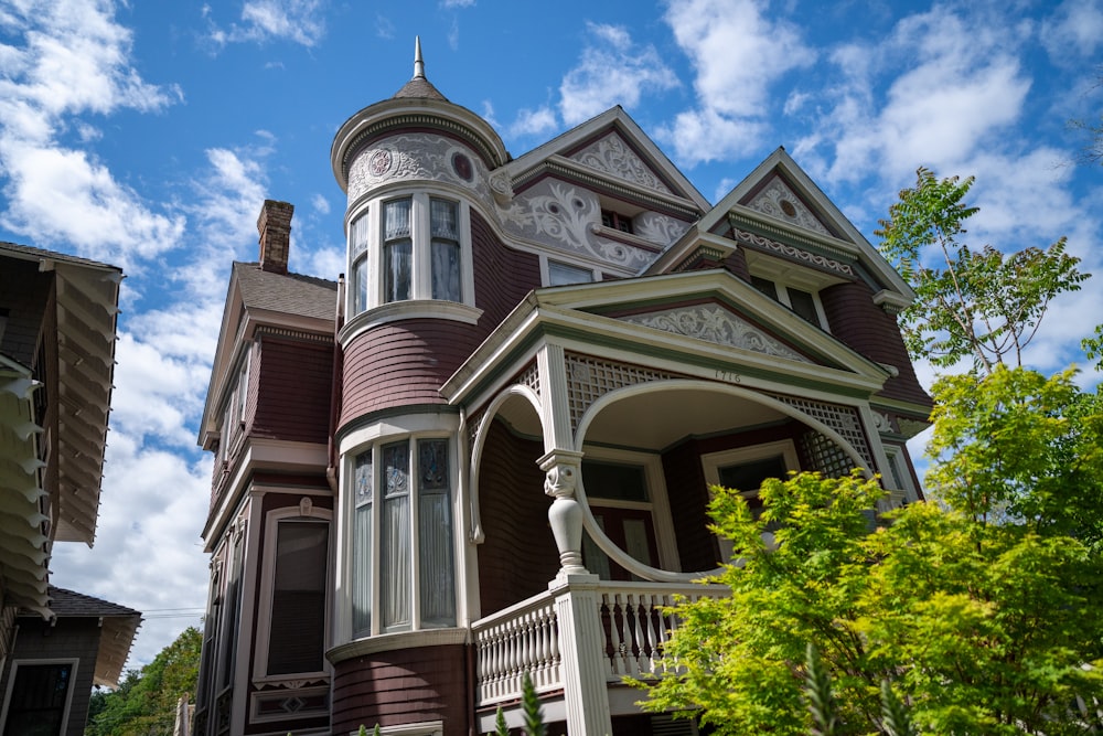 a large house with a clock on the front of it