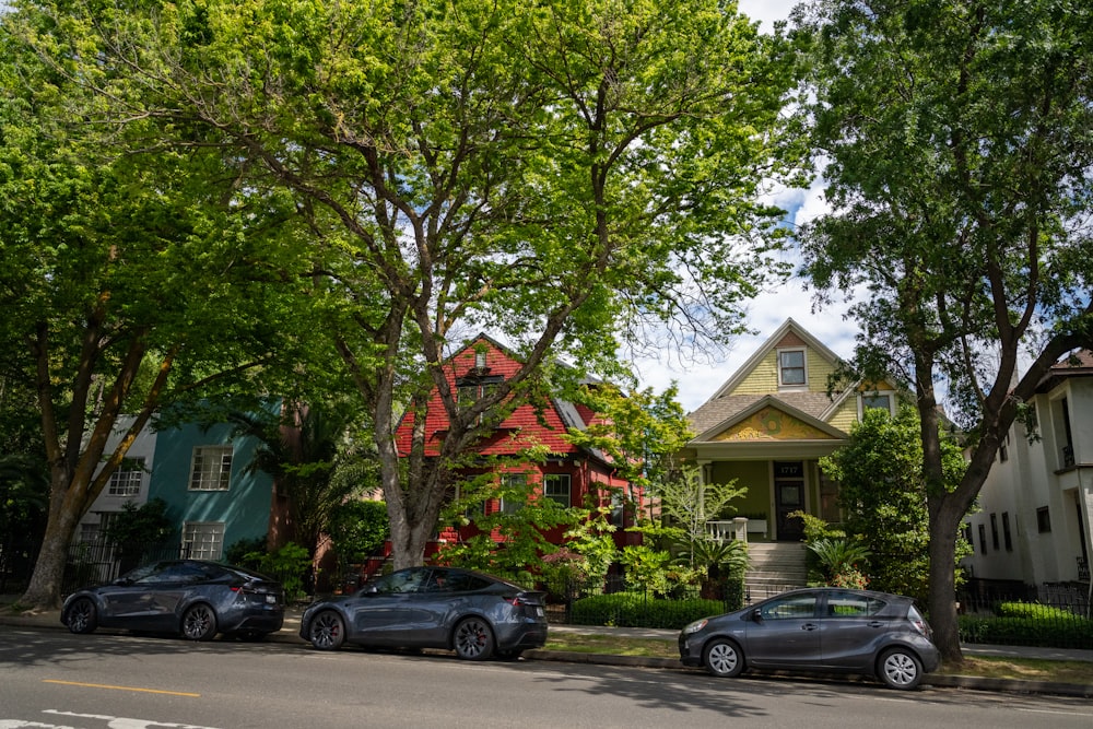 three cars parked on the side of the road