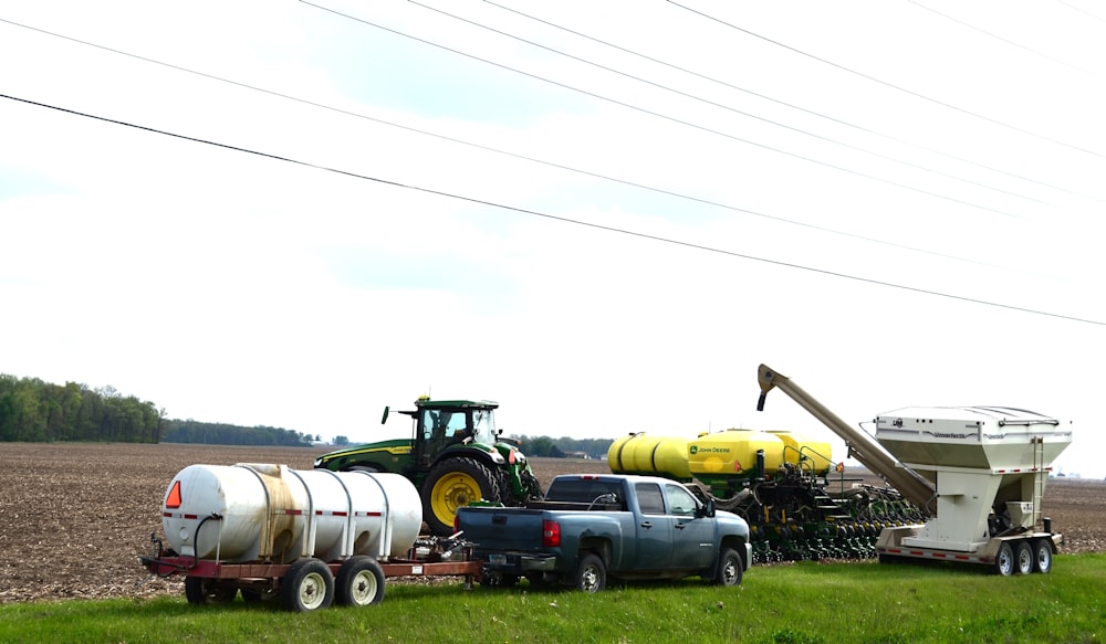 a tractor pulling a trailer with a trailer attached to it