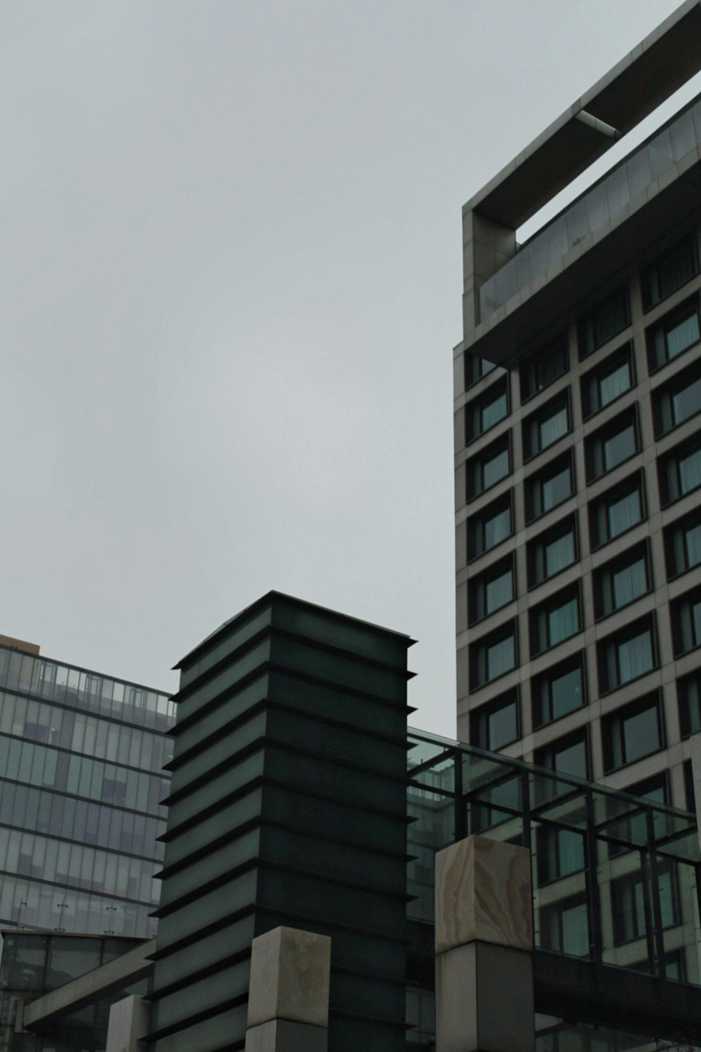 a clock on a pole in front of a building