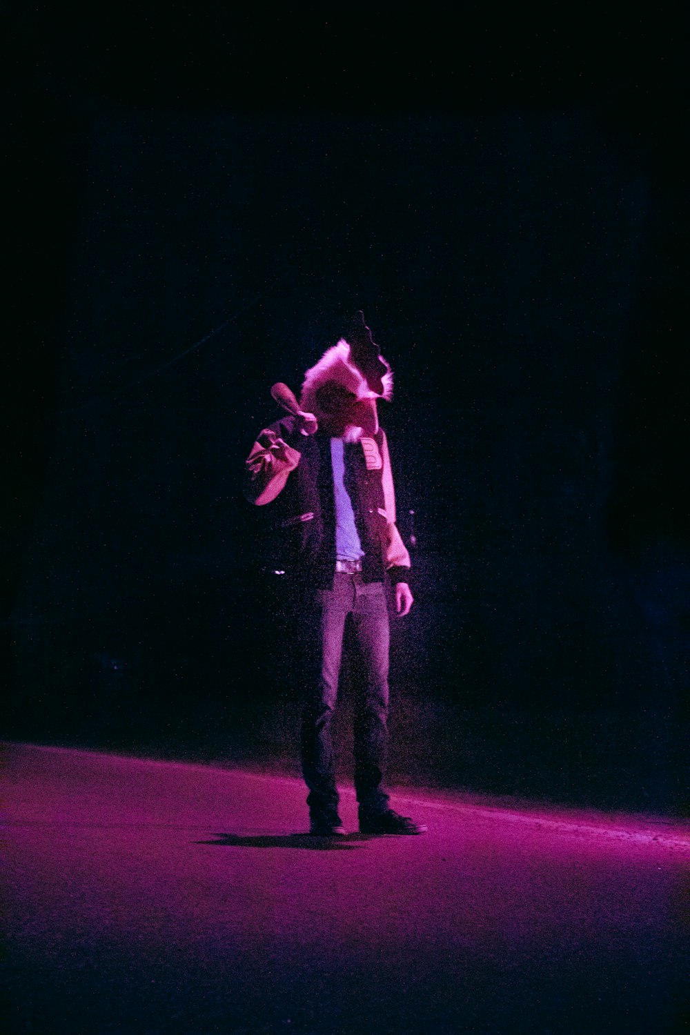 a man standing on a stage with a microphone