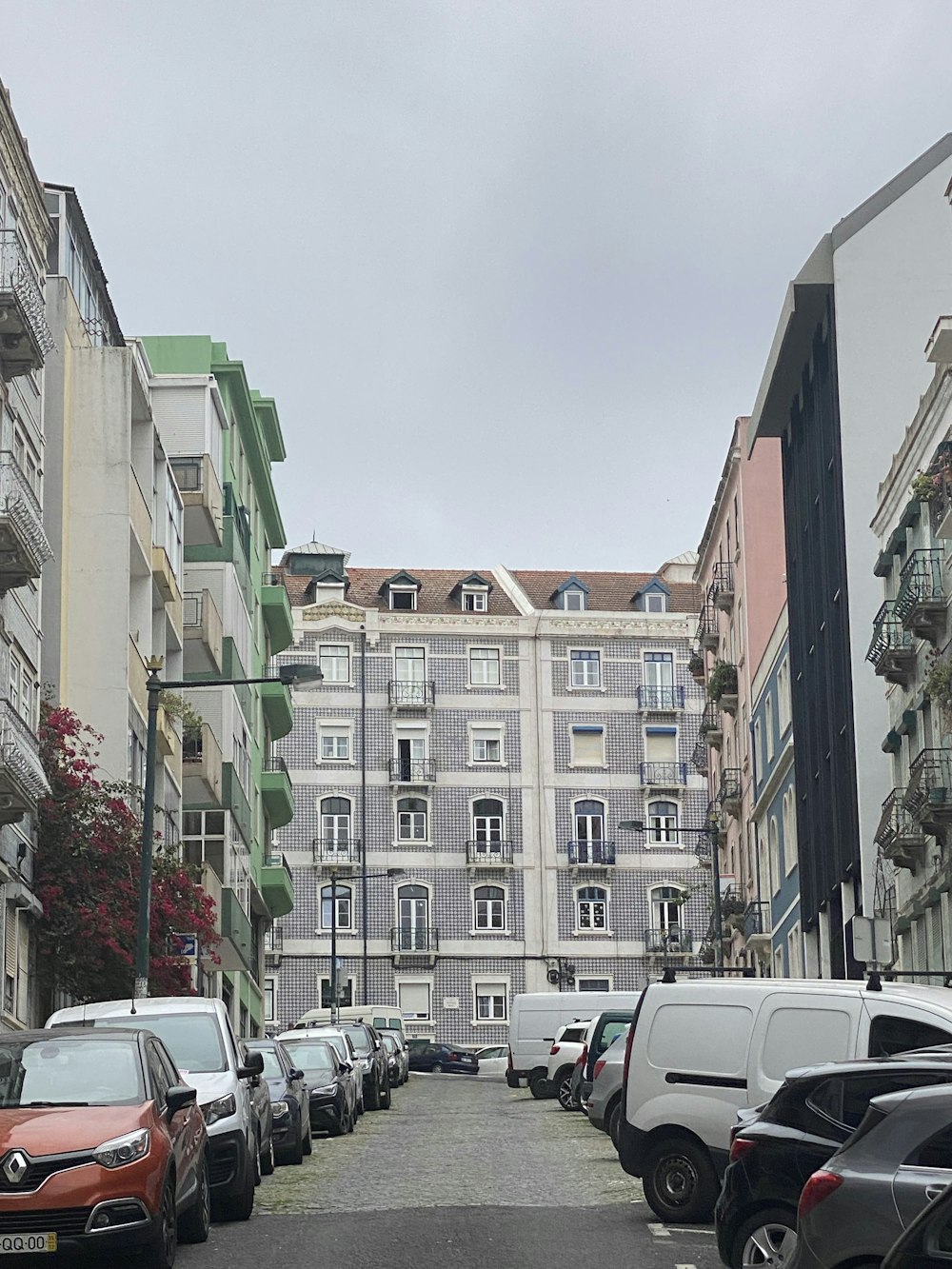 a row of parked cars on a city street