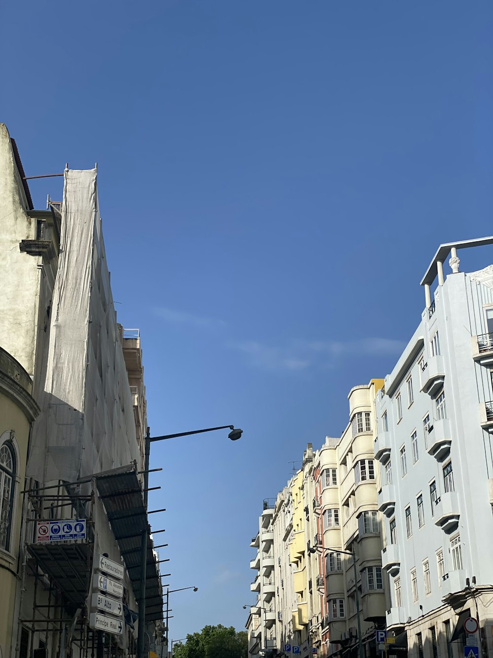 a city street filled with lots of tall buildings