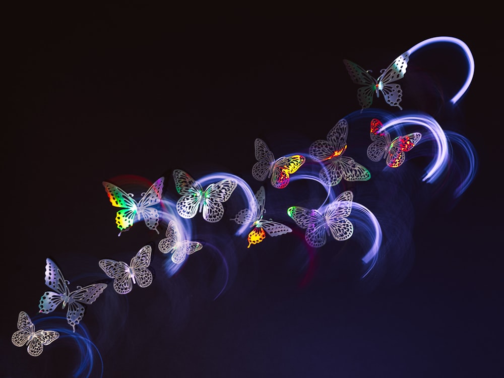 a group of butterflies flying through the air