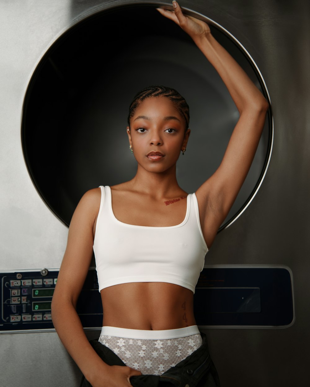 a woman standing in front of a machine