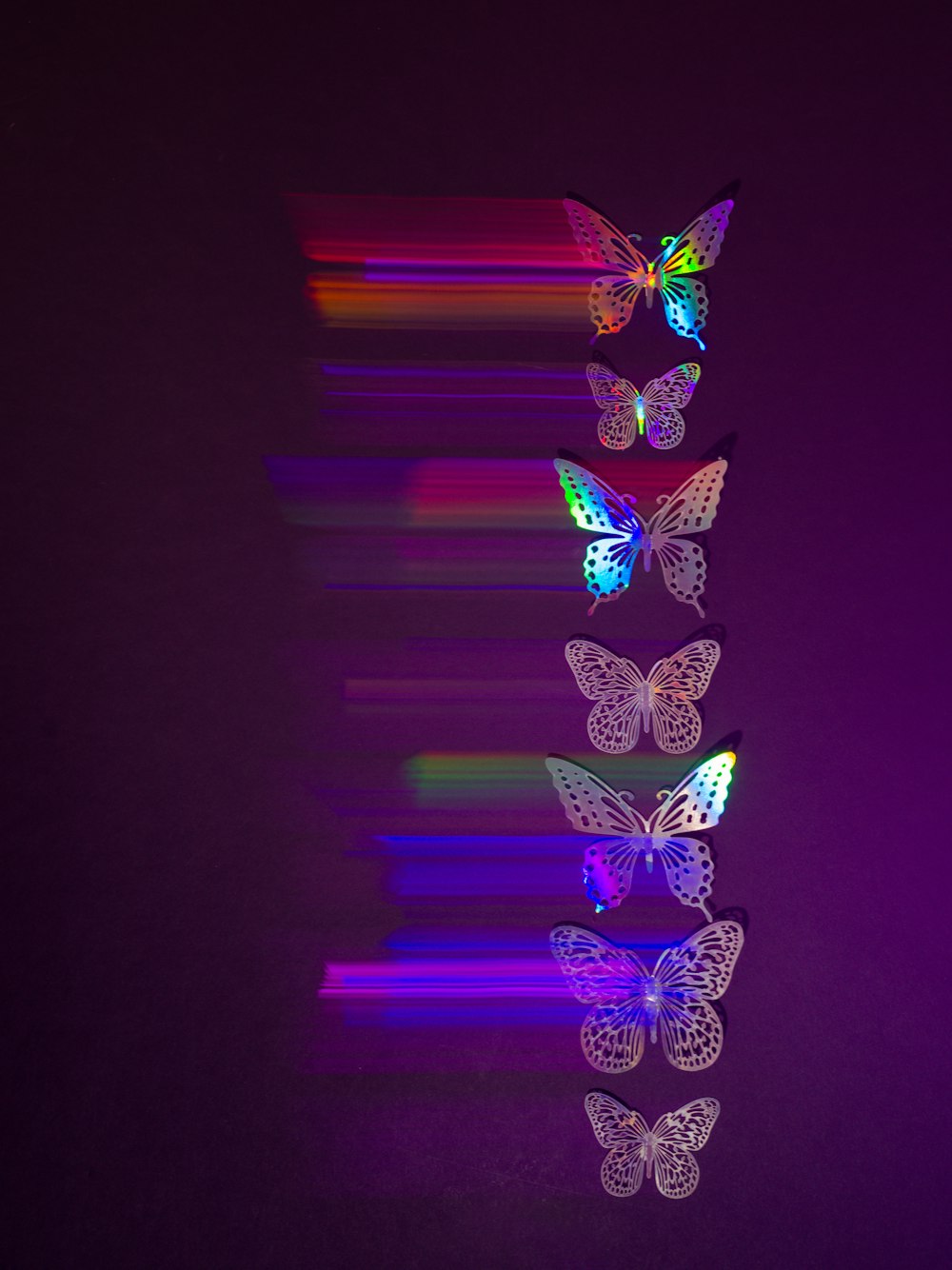 a group of butterflies flying through the air