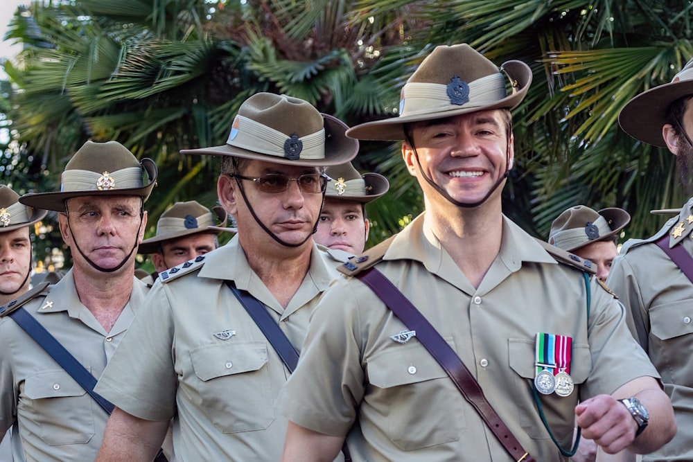 a group of uniformed men standing next to each other