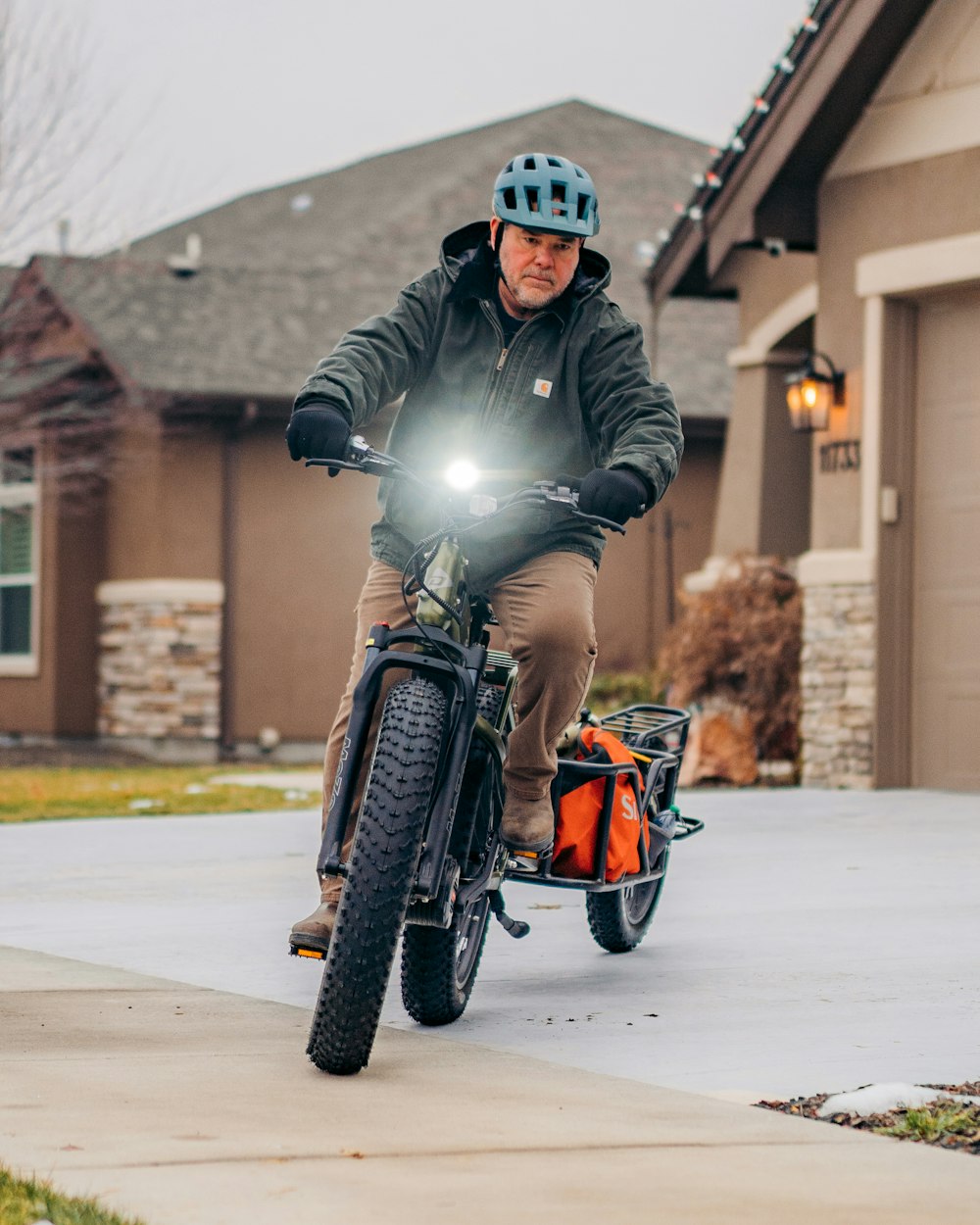 a man riding a bike with a light on it