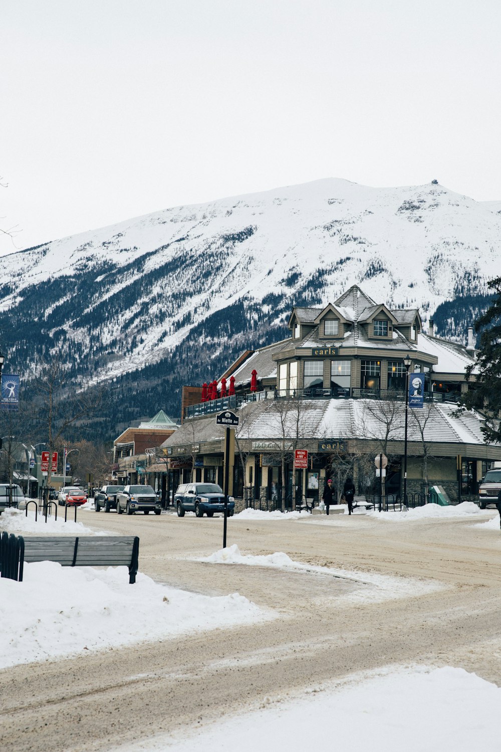 a town with a snow covered mountain in the background