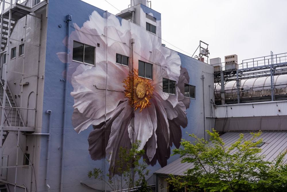 a large flower painted on the side of a building