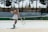 a woman is playing tennis on a tennis court