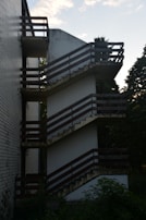 a tall building with a bunch of balconies on it