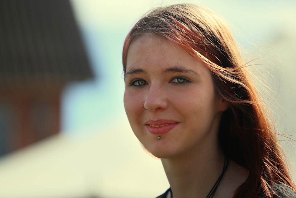 a woman with a necklace on her neck