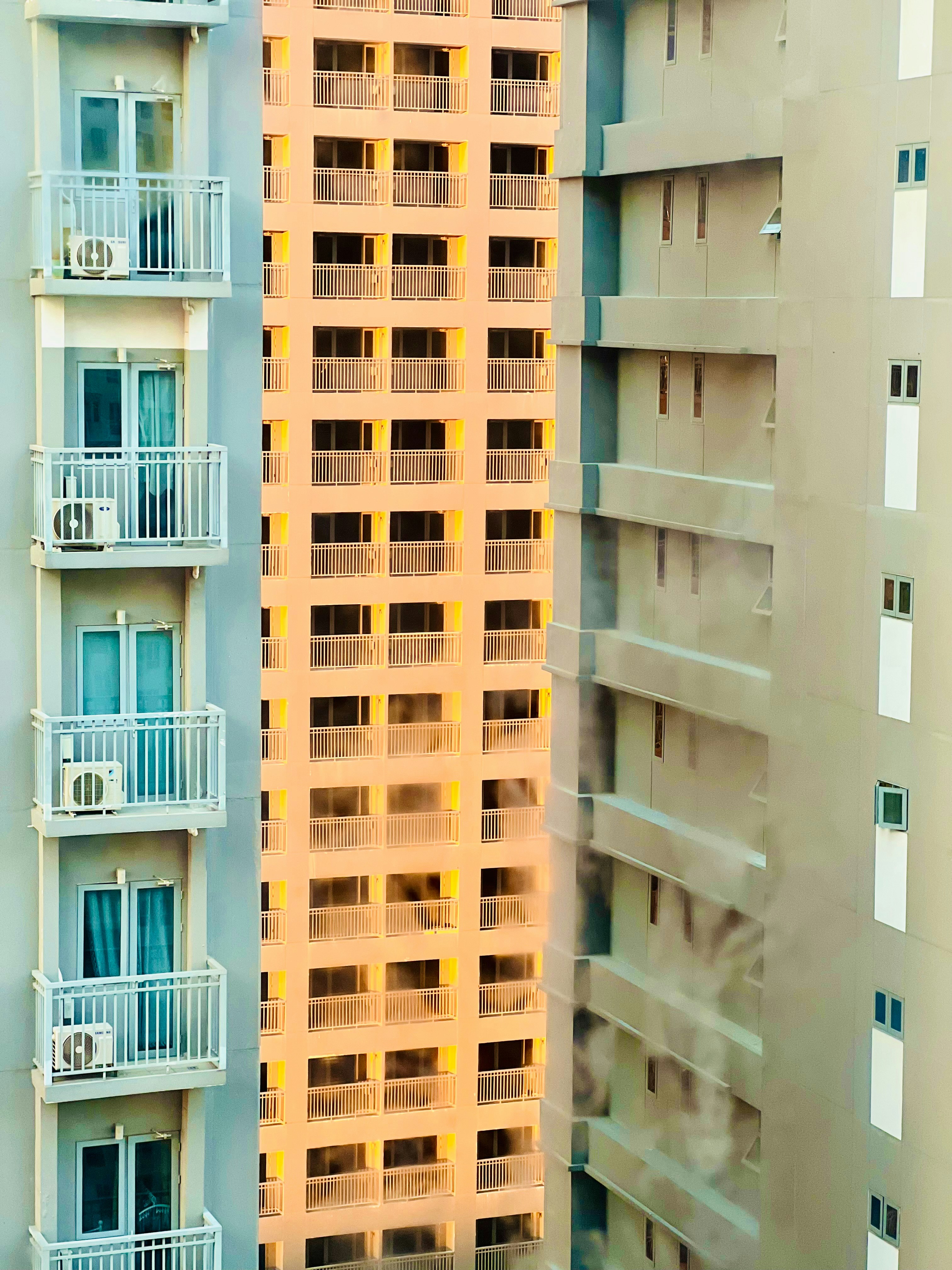 a couple of tall buildings next to each other