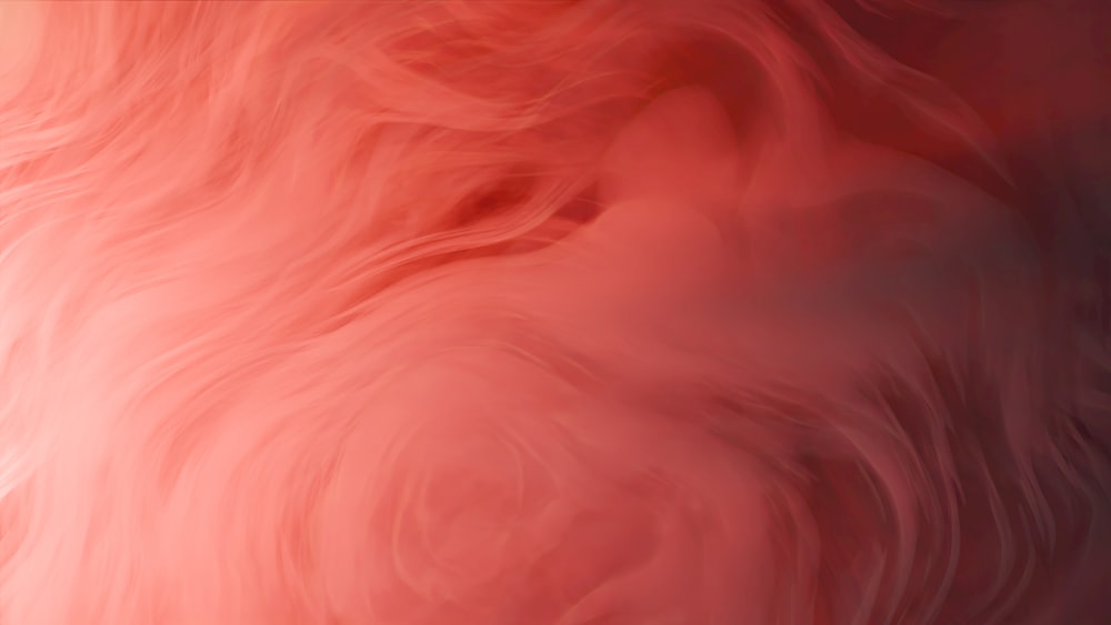 a blurry image of a red and pink background