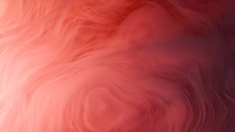 a blurry image of a red and pink background