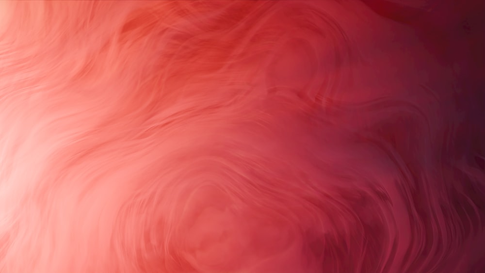 a blurry image of a red and pink background