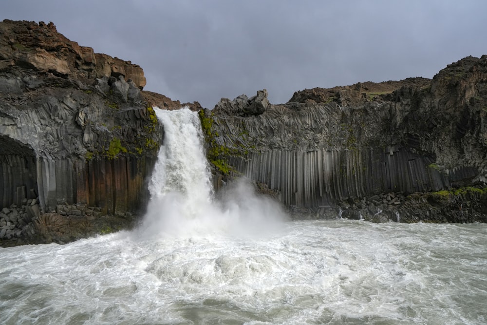 a large waterfall with a bunch of water coming out of it