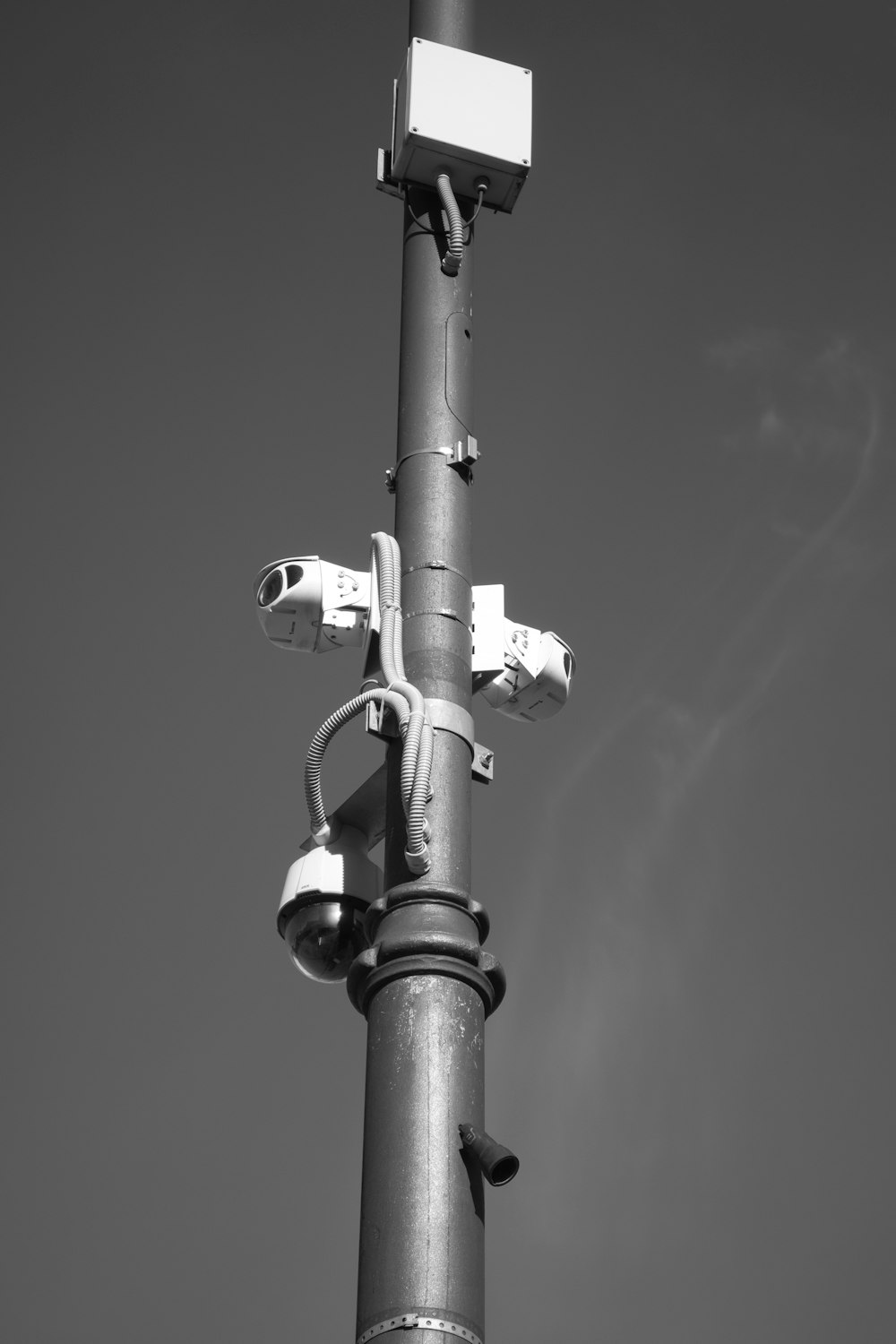 a black and white photo of a street light