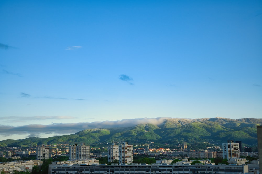 a view of a city with mountains in the background