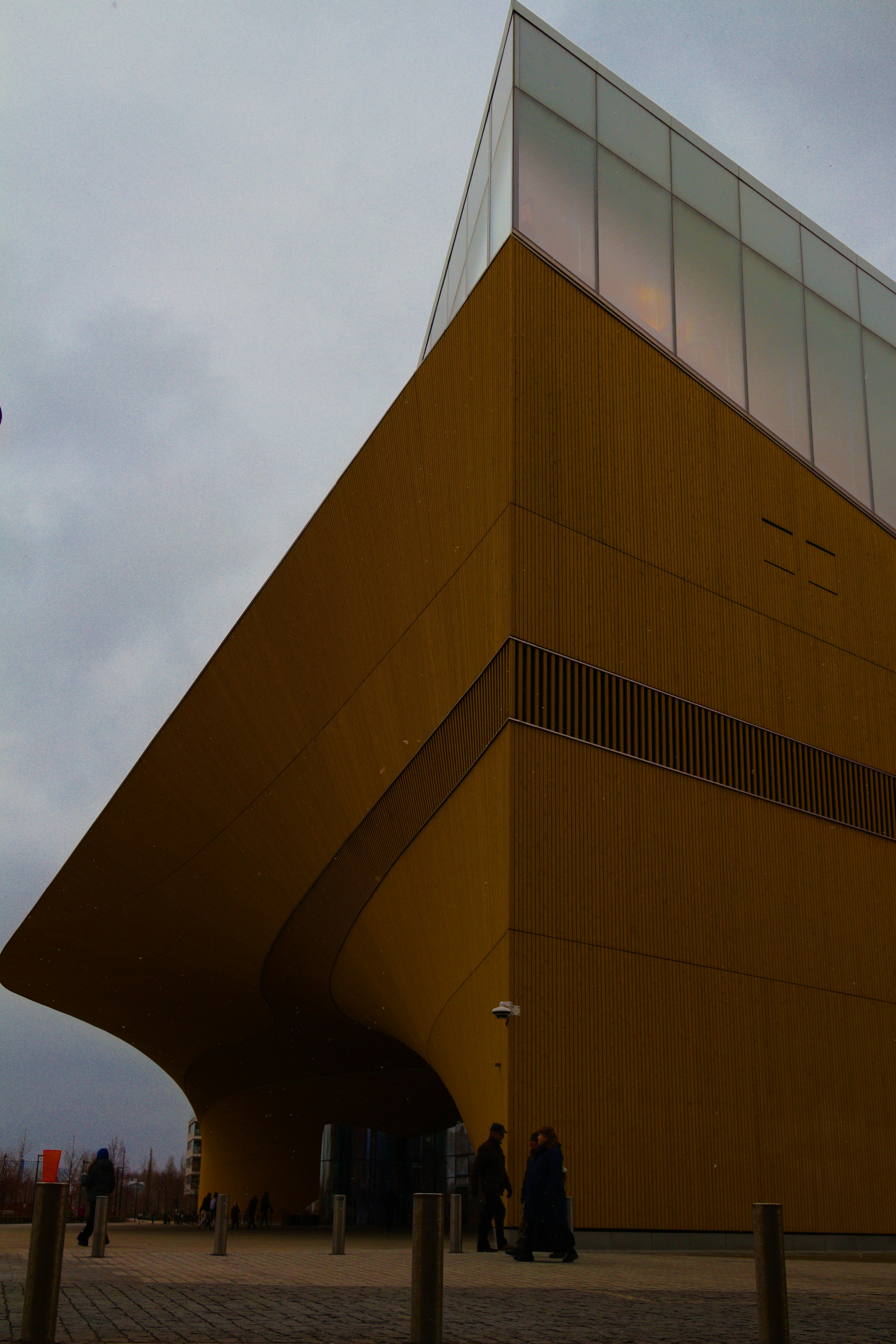 a building with a large triangular shaped structure on top of it