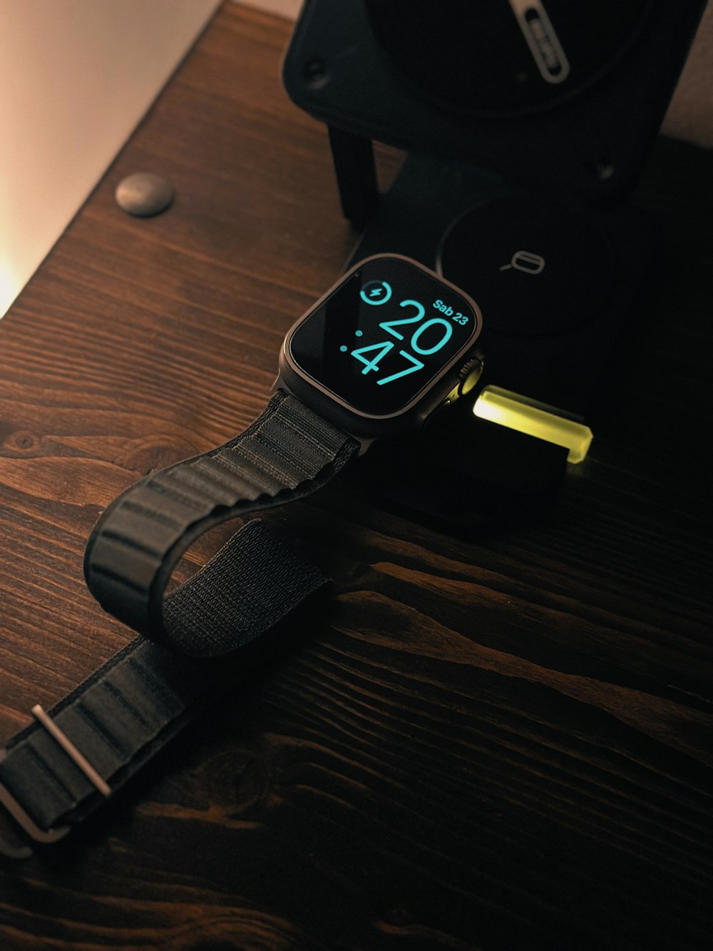 a smart watch sitting on top of a wooden table