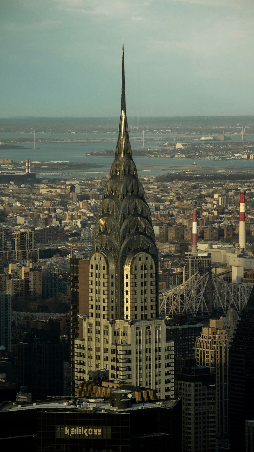 a very tall building with a spire in the middle of a city