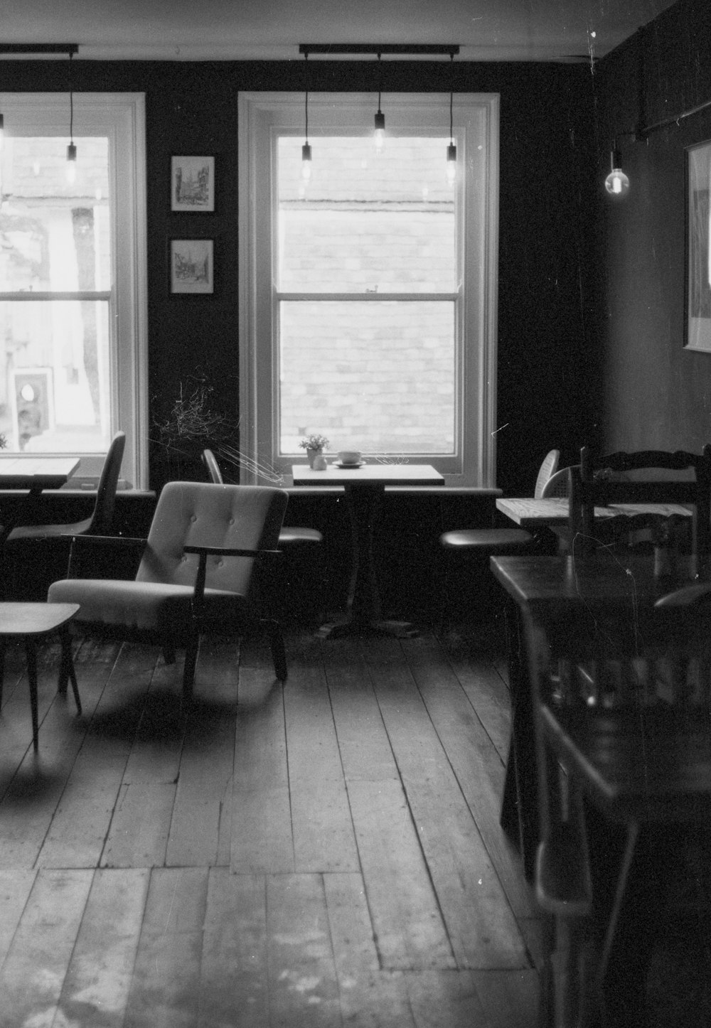 a black and white photo of a restaurant