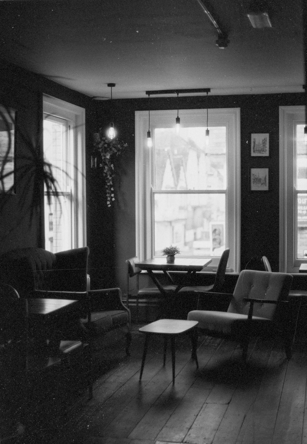 a black and white photo of a living room