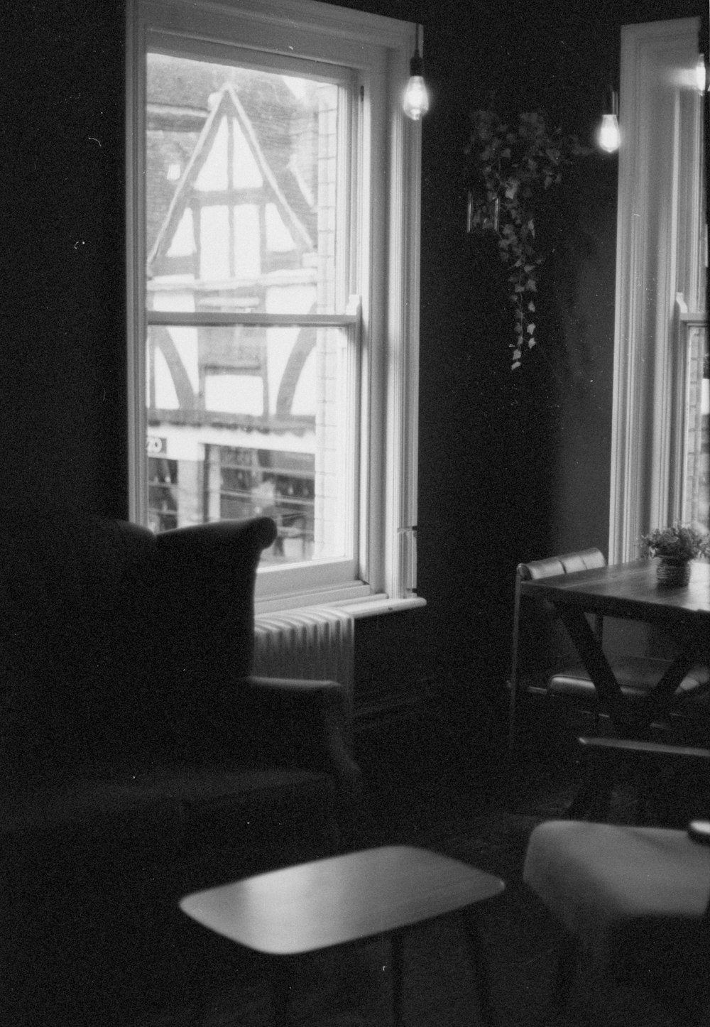 a black and white photo of a living room