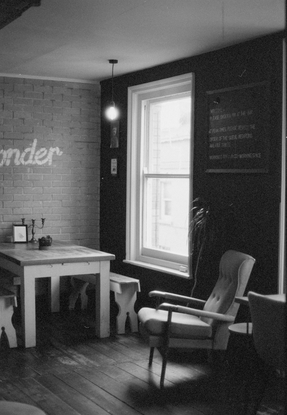 a black and white photo of a corner of a room