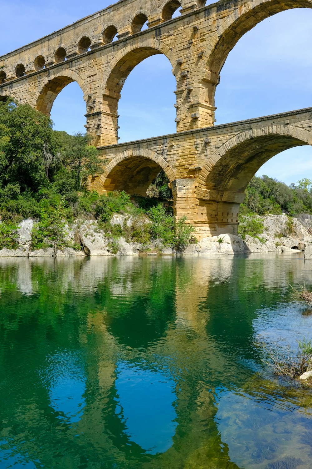 an old stone bridge over a river