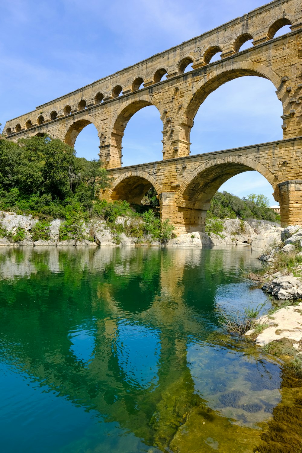 an old stone bridge over a river