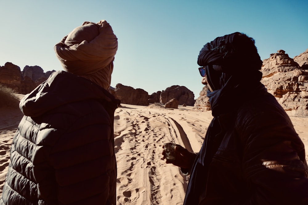 a couple of people that are standing in the dirt