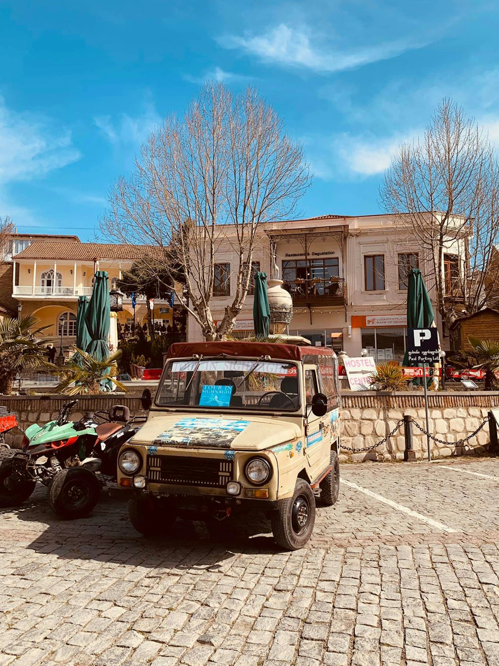 an old truck parked in front of a building