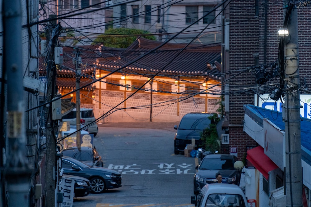 a city street with cars parked on the side of it