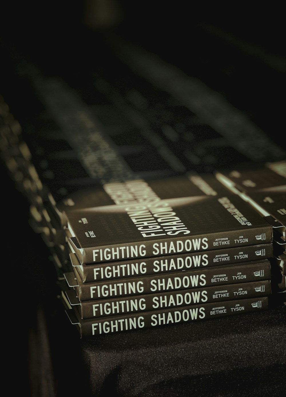 a stack of books sitting on top of a table