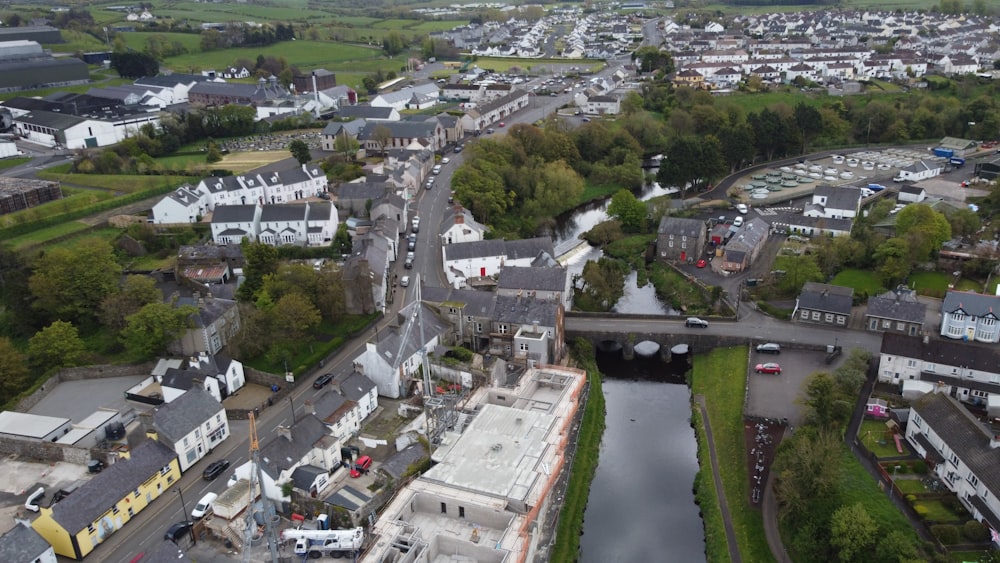 an aerial view of a town with a bridge