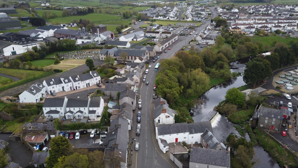 an aerial view of a town with a river running through it