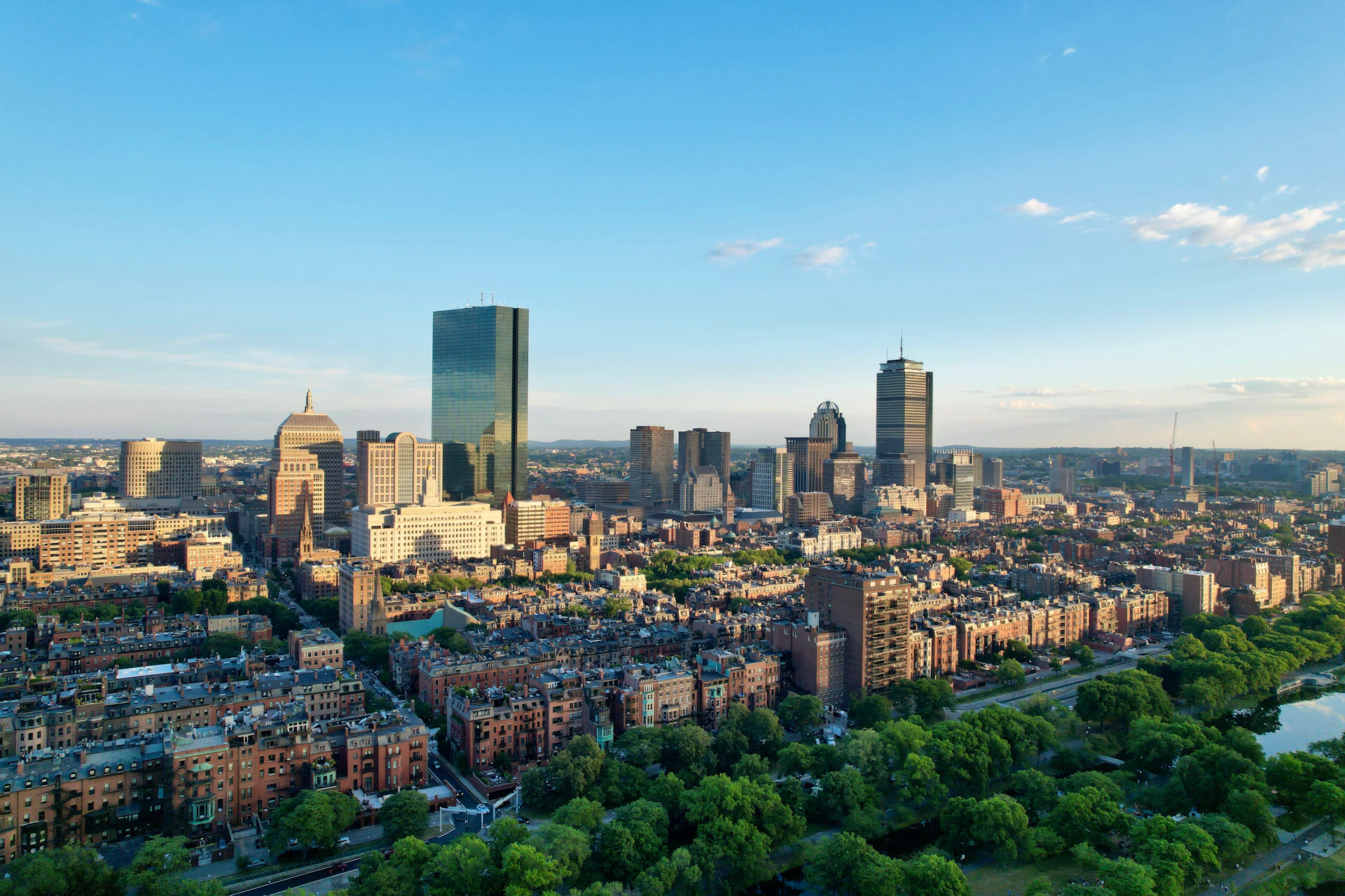 an aerial view of a city with tall buildings