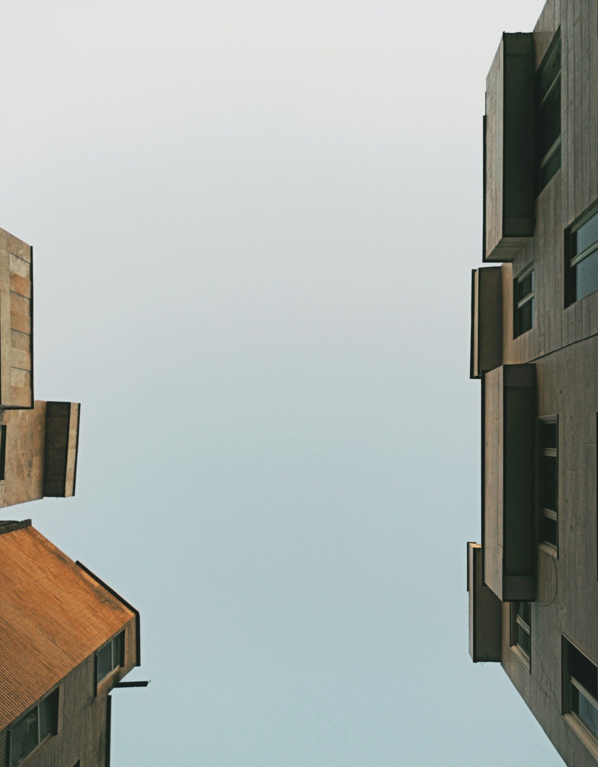 looking up at a tall building from the ground
