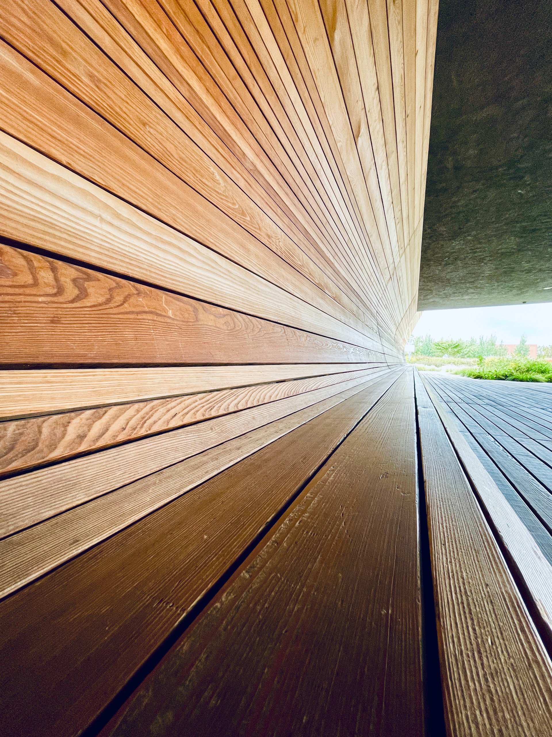 a close up of a wooden floor with a sky background