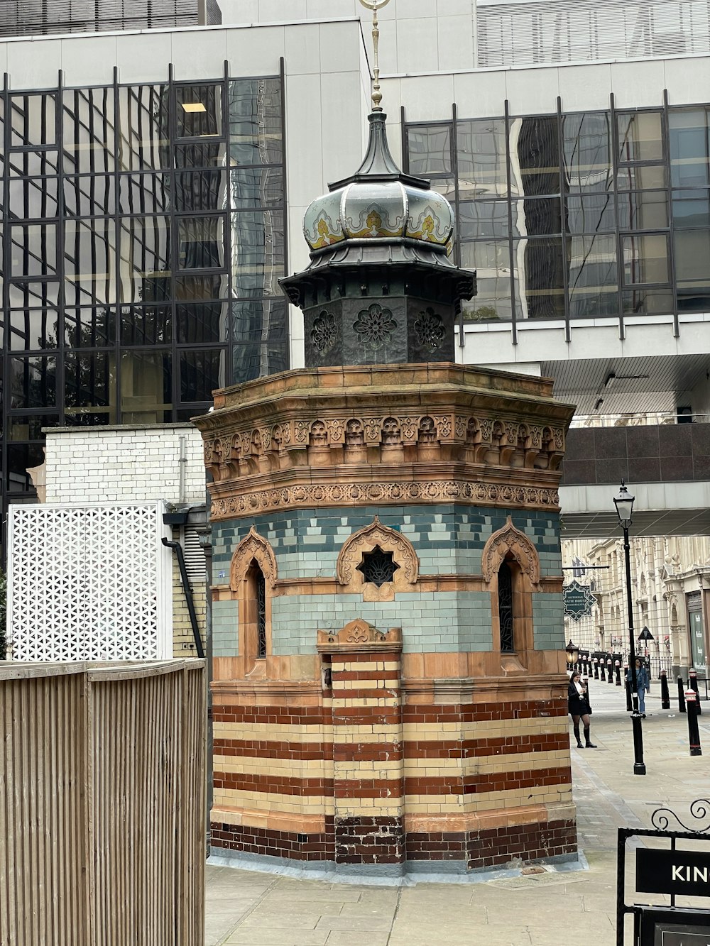 a clock tower in the middle of a city