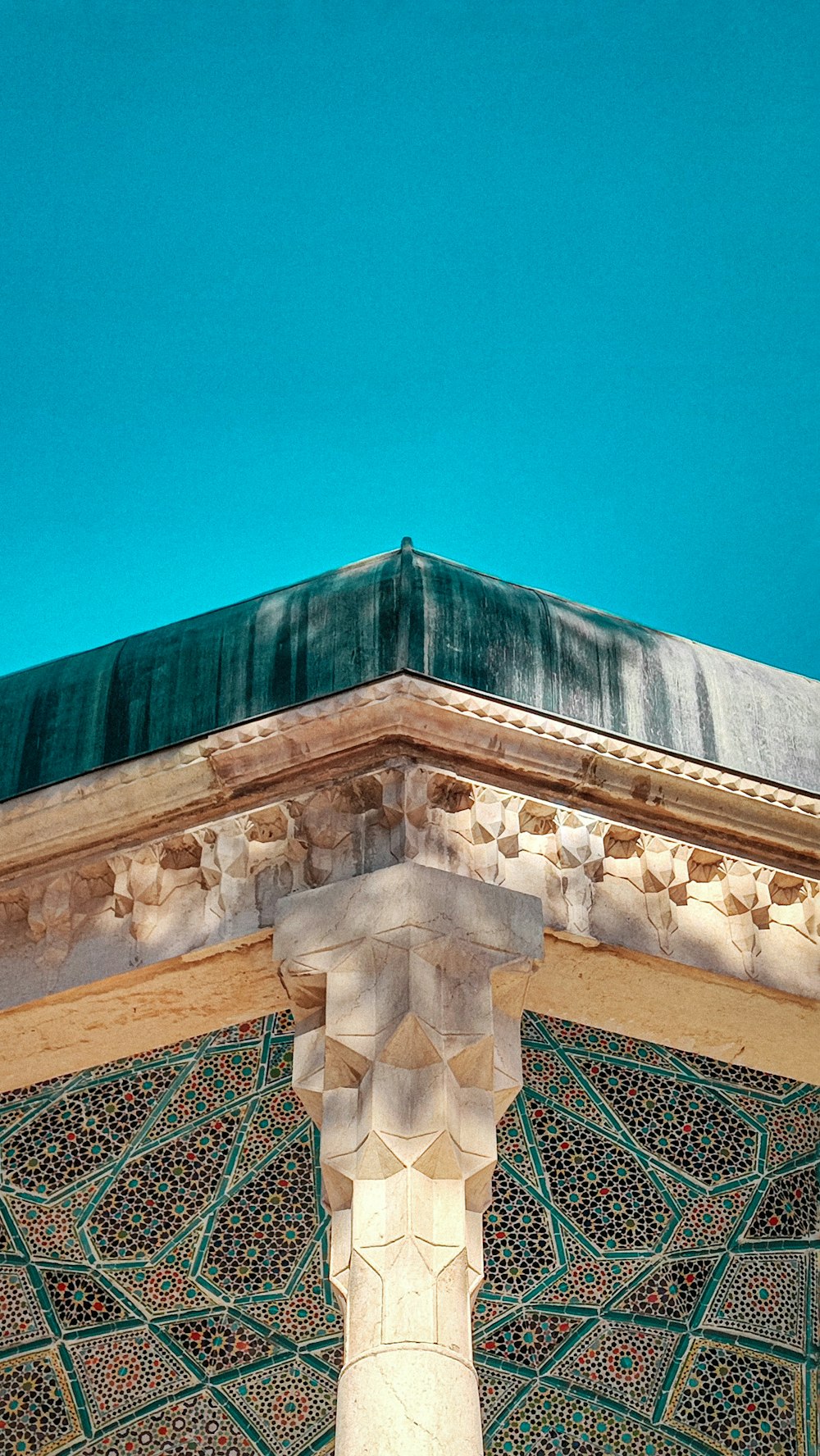 a close up of a building with a blue sky in the background