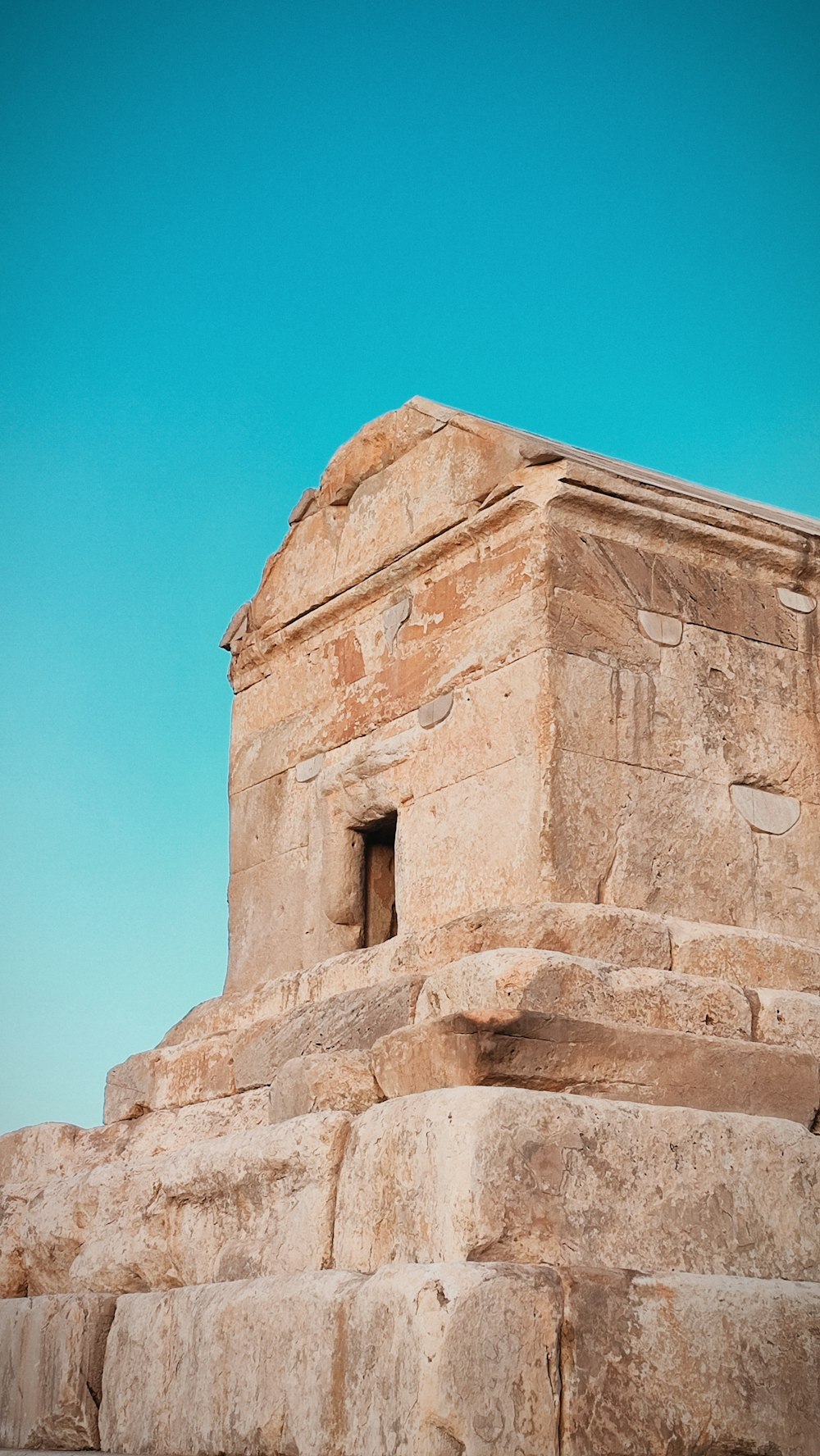 a large stone structure sitting on top of a hill