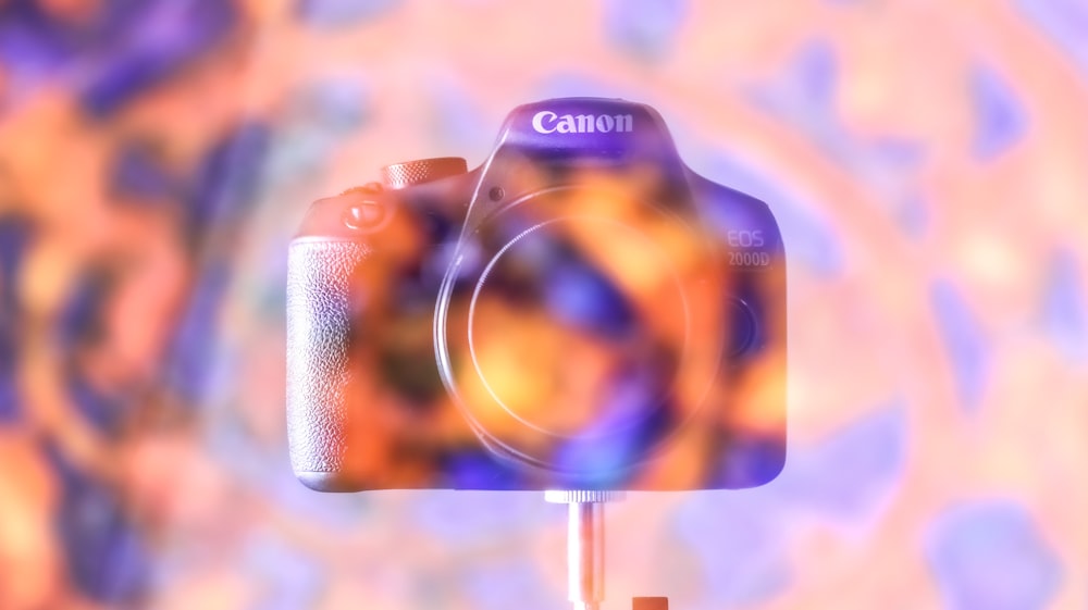 a digital camera sitting on top of a tripod