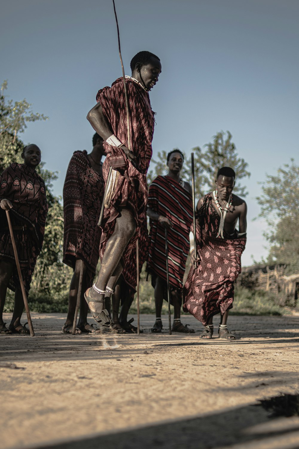 a group of people standing around each other