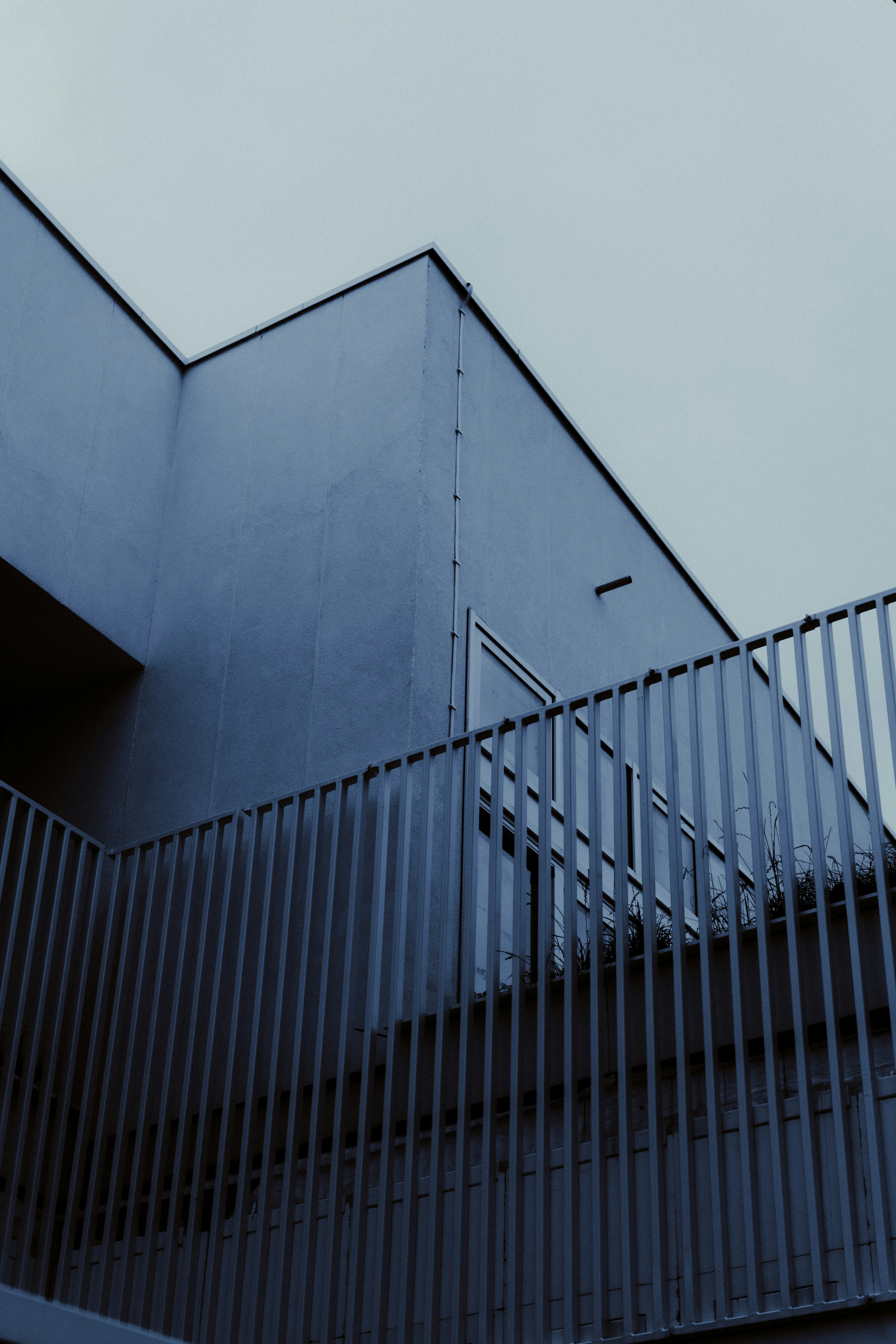 a tall building with a metal fence around it